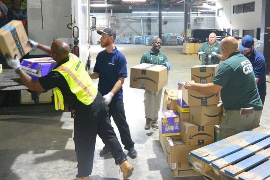 Roosevelt Islanders, All Ages, Pitch In for Puerto Rico Teams of volunteers from around New York City load goods onto trucks heading to the airport.